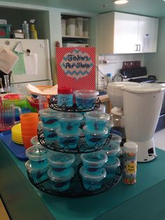 there are many cups and bowls on the counter