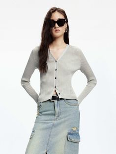 MO&Co. Women's Ribbed Knit Slim Cardigan The textured ribbed design, accented with metallic details, adds a touch of sophistication to any outfit. With its slim and stretchy fit, this cropped cardigan pairs perfectly with high-waisted skirts for a chic ensemble. Features : - Slim stretchy fit, cropped cut- V-neckline, long sleeves- Ribbed texture with metallic details Code: MBD1CAR020The back length of size S is 52.5cmMATERIALS & CARE Material: 68% Polyamide 32% Metallized fibreREMINDER: All ite Chic Cropped Cardigan With Textured Knit, Chic Cropped Textured Knit Cardigan, Spring Cropped Ribbed Cardigan, Spring Fitted Textured Knit Cardigan, Spring Textured Knit Fitted Cardigan, Chic Cropped Ribbed Cardigan, Fitted Cropped Cardigan For Workwear, Chic Ribbed Cardigan, Ribbed Cropped Cardigan For Fall