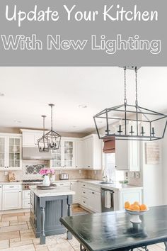 an open kitchen with new lighting in the center and white cabinets on the other side