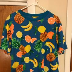 Beautiful Hawaiian Pineapple T-Shirt. Casual T-shirt With Vibrant Print, Casual T-shirt With Vibrant Print And Short Sleeves, Casual Short Sleeve T-shirt With Vibrant Print, Orange Vibrant Print Short Sleeve Tops, Casual Orange Printed T-shirt, Casual Orange Fruit Print Top, Blue Vibrant Print Short Sleeve Top, Blue Short Sleeve Top With Vibrant Print, Fun Short Sleeve T-shirt With Fruit Print