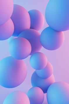 blue and pink balls floating in the air