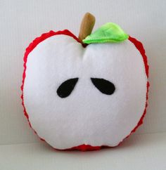 an apple stuffed animal with a green leaf on top