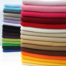 a stack of folded towels sitting on top of each other