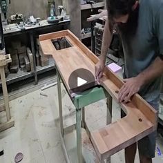 a man working on a piece of wood