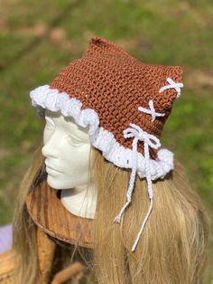 a crocheted hat is on top of a mannequin's head