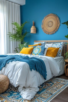 a bedroom with blue walls, white bedding and lots of pillows on the floor