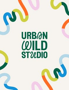 the words urban wild studio surrounded by colorful streamers in green, blue, yellow and orange