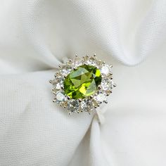 Dainty Peridot Ring, Peridot stacking Ring, Green Peridot and CZ Ring, Luxury Ring, Sterling Silver Ring, Delicate Ring, Bridesmaid Gift by JohrifinejewelleryCo on Etsy Green Gemstone Flower Ring, Green Halo Promise Ring, Green Halo Rings For Gift, Green Peridot Crystal Ring For Weddings, Green Halo Rings As A Gift, Green Open Ring Cluster For Wedding, Lime Green Gemstone Rings For Wedding, Green Open Cluster Ring For Wedding, Green Crystal Ring With Halo Setting For Wedding