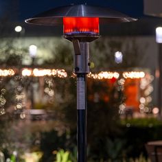 an outdoor patio heater sitting on top of a table