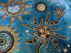 the sun, moon and stars are painted on fabric