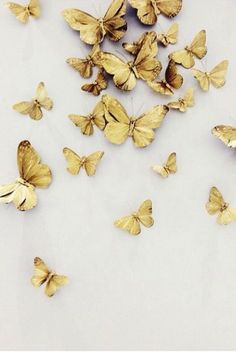 some yellow butterflies are on a white surface and there is the words sweet dreams above them