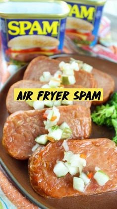 some meat and vegetables are on a plate with spam tins in the background