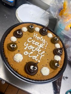 a cake that is sitting on top of a table with frosting and icing