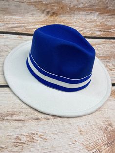 Blue and white fedora White Fedora Felt Hat For Beach, White Fedora Felt Hat For The Beach, Casual White Brimmed Fedora, Casual White Flat Brim Fedora, Classic White Felt Hat For Beach, Casual White Felt Hat For Beach, Casual White Felt Hat For The Beach, Casual White Brimmed Felt Hat, White Flat Brim Casual Felt Hat