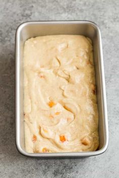 a pan filled with batter sitting on top of a counter