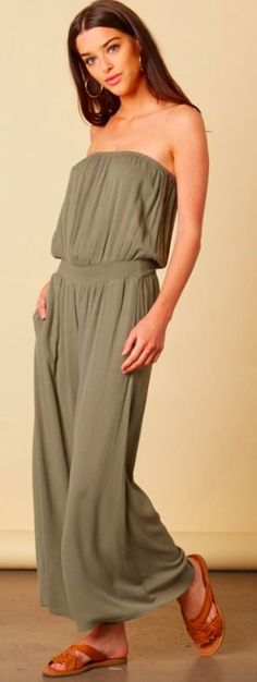 Olive Strapless Jumpsuit. Exotic getaways aren't complete without the Keli Olive Strapless Wide Leg Jumpsuit! Olive lightweight rayon shapes a strapless tube jumpsuit bodice, (with elasticized neckline and waist) and attached wide leg pants. Smocked elastic cinches waist, while side-seam pockets add effortless ease. Olive Green Jumpsuit, Cute Thanksgiving Outfits, Tube Jumpsuit, Comfortable Chic, Boho Pink, Green Jumpsuit, Strapless Jumpsuit, Pink Boho, Thanksgiving Outfit