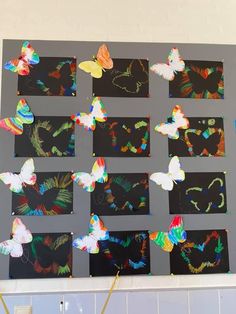 the butterflies are all over the wall and on the black paper, which has been cut out