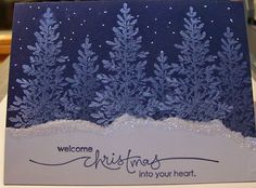 a blue christmas card with snowflakes on it