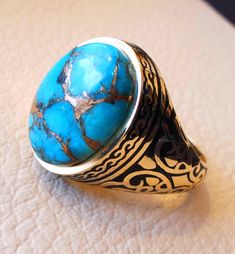 18k gold men ring copper blue turquoise cabochon high quality natural stone all sizes Ottoman signet style fine jewelry fast shipping gold : 18 k gold Total ring weight : 13.00 - 15 gram ( changes due to sizing ) Stone size : 18 mm X 13 mm stamped 750 wood nice gift box included . certificate invoice from our shop of weight and gold purity . Risk free Quality guarantee policy : If you are not satisfied with your item for any reason simply send it to us and you will get a replacement or refund . Gold Men Ring, Ocean Jasper Jewelry, Mens Turquoise Rings, Solomons Ring, Art Deco Women, Promise Jewelry, White Gold Bridal Set, Jasper Jewelry, Moonstone Engagement