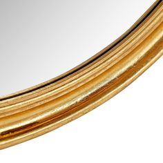 a close up of a mirror with gold trimmings on the edges and sides