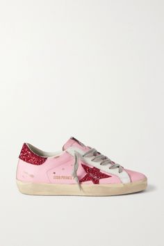 EXCLUSIVE AT NET-A-PORTER. Golden Goose's 'Superstar' sneakers are carefully distressed by hand, so each pair has a one-of-a-kind finish. Set on bouncy rubber soles, they're detailed with glittered heel tabs and star motifs. The pink and red colorway will look best with both neutral hues. Golden Goose Sneakers Outfit, Golden Goose Superstar, Golden Goose Sneakers, Golden Goose Shoes, Golden Goose Deluxe Brand, Sneakers Outfit