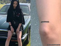 a woman sitting on the hood of a car next to a tattoo that reads, i love you