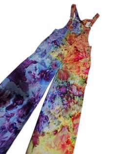 These one of a kind tie dye overalls are perfect for any season.  Made from cotton non- stretch denim overalls they are a cozy and colorful outfit. Each pattern is unique and created with fiber reactive dyes and ice.  Listing is for the the pair shown above.  Please see sizing chart for fit. Feel free to message me with questions. Hippie Multicolor Cotton Overalls, Multicolor Cotton Hippie Overalls, Multicolor Cotton Overalls For Festival, Multicolor Festival Overalls, Festival Multicolor Cotton Overalls, Multicolor Cotton Jumpsuits And Rompers For Festivals, Multicolor Cotton Overalls Jumpsuit, Multicolor Cotton Overalls And Rompers, Poofy Pants