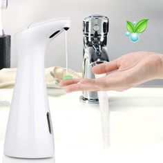 a person is holding their hand near a faucet with water coming out of it