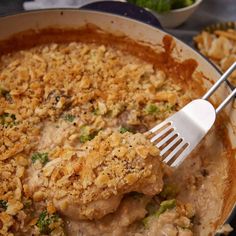 a casserole dish with chicken and broccoli covered in gravy