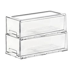 two clear plastic drawers are stacked on top of each other