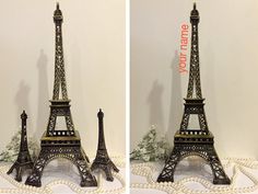 two pictures of the eiffel tower made out of cake and pearls on display