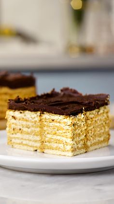 two pieces of cake sitting on top of a white plate