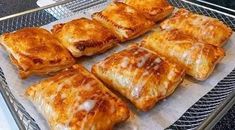 some food is laying out on a metal grill tray and ready to be cooked in the oven