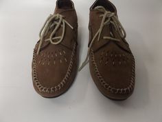 vintage 90s leather moccasins ankle booties. muted brown color soft leather with crossed stitching along the side seams and woven stitching on the foot. rounded toes and flat rubber soles . US women's size 7 on shoes, see measurements for accurate fit. LABEL || hush puppies MATERIAL || leather and rubber CONDITION || great | some spotting on the sides and water marks on the back heels, see all pictures MEASUREMENTS IN INCHES size - US 7 women's insole length - 9 across foot - 3 heel height - les Bohemian Leather Moccasins For Fall, Fall Bohemian Leather Moccasins, Brown Bohemian Moccasins For Fall, Bohemian Brown Moccasins For Fall, Boho Flat, Hippy Dress, Muted Brown, Dress Minimal, Boho Hippie Dress