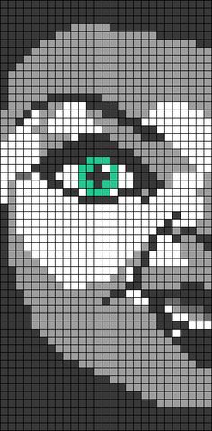 an image of a man's face made out of pixellated squares with green eyes