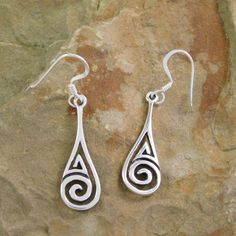 Celtic Spiral earrings, wear your heritage proudly with this dainty pair of earrings. Metal:  .925 Sterling Silver Hallmark:  .925 Face width:  7 mm Drop:  Approx.  37 mm ( 1.45 inches) Earrings are casted by my hubby and hand finished & polished by me So their may be a few very slight imperfections . We started sand casting simple silver pendants over 20 years ago and as we learned started casting more intricate pieces. Over time we got better and  to fund our hobby started selling at flea mark Spiral Sterling Silver Earrings For Anniversary, Sterling Silver Spiral Earrings For Anniversary, Sterling Silver Swirl Jewelry With Matching Earrings, Anniversary Spiral Sterling Silver Earrings, Sterling Silver Swirl Earrings For Gift, Swirl Shaped Sterling Silver Earrings For Gifts, Hypoallergenic Sterling Silver Swirl Earrings, Hypoallergenic Spiral Sterling Silver Jewelry, Spiral Sterling Silver Pierced Earrings