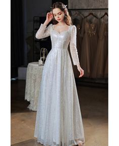 Full Sleeves Prom Dress, Long Sleeve Fitted Prom Dress, White Sparkle Dress Long, Long Prom Dress With Sleeves, Sparkly Modest Dress, Silver Long Dress Formal Gowns, Modest Sparkly Dress, Modest Sequin Dress, Fitted Long Sleeve Winter Gown