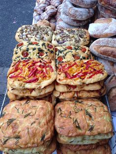 many different types of pastries are on display