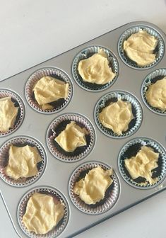 a muffin tin filled with cupcake batter