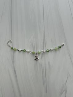 This bracelet consists of a Green and white base bracelet, which you can customized the charm for based on the image depicting all the charm options available! This specific bracelet originally comes with a puppy charm. Pearl Charm Bracelet, Pearl Charms, A Puppy, Adjustable Bracelet, Charm Bracelets, Green And White, Jewelry Bracelets, Etsy Accessories, Handmade Items