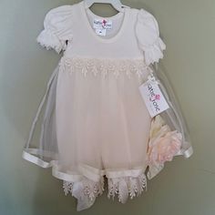 Gorgeous Dress For Baby's Baptism Or Any Celebration. Adorned With Intricate Detail Of Tulle, Ribbons, And Lace. Headband With Large Rose Included. Fitted Pink Baptism Dress With Short Sleeves, Pink Short Sleeve Fitted Baptism Dress, Fitted Short Sleeve Pink Baptism Dress, Cream Short Sleeve Fitted Baptism Dress, Fitted Short Sleeve Baptism Dress With Ruffles, Short Sleeve Fitted Baptism Dress, Cream Baptism Dress With Short Sleeves, Cream Short Sleeve Baptism Dress, Cream Short Sleeve Dress For First Communion