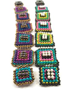 "\"Contemplation is the highest form of activity.\" - Aristotle Right Angle Weave Squares of multiple colors embellished with Swarovski pearls. Have fun using multi-colors of metal seed beads for each square. Make each one exactly the same or do what I did and make each one slightly different for added interest. You will need: Size 11/0 metal seed beads in five colors Swarovski 3mm pearls Size 4 Snap 14lb. Fireline is recommended for this project. INTERMEDIATE PROJECT - Must know Right Angle Wea Multicolor Rectangular Beaded Bracelets For Festivals, Handmade Adjustable Square Beaded Bracelets, Multicolor Rectangular Bracelets With Colorful Beads, Multicolor Beaded Rectangular Jewelry, Festival Multicolor Rectangular Beaded Bracelet, Multicolor Square Beaded Jewelry, Large Rectangular Multicolor Beads, Right Angle Weave, Swarovski Pearls