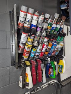 a shelf filled with lots of different types of paint