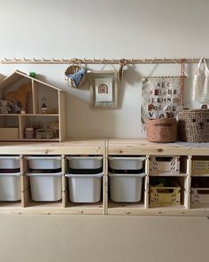 the shelves are filled with plastic containers and baskets for storage, along with other items