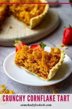 a slice of crunchy cornflake tart on a plate with strawberries