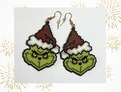 These stunning handmade beaded Grinch earrings are the perfect way to get into the holiday spirit. The earrings are not only a stylish accessory but also a conversation starter and being handmade ensures that each pair is unique, making them a special gift idea for Grinch lovers and jewellery enthusiasts alike.  Japanese Miyuki Delica glass seed beads size 11 were used in making these fabulous earrings, in the colours red, white, linen, yellow, black, light and dark green, gold or silver, using Handmade Festive Earrings For Christmas, Handmade Beaded Earrings For Holiday Party, Holiday Party Handmade Beaded Earrings, Handmade Beaded Earrings For Christmas, Handmade Beaded Earrings For Christmas Party, Handmade Beaded Earrings For Christmas Holiday, Green Beaded Earrings For Holidays, Christmas Dangle Beaded Earrings With Colorful Beads, Christmas Colorful Beaded Dangle Earrings