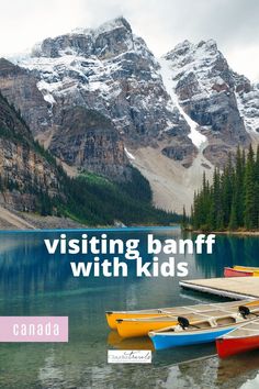 three canoes are docked in the water with mountains in the background and text that reads visiting banff with kids canada