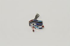 Eye of Horus , Handmade Egyptian sterling silver pendant inlaid with stones . The Eye of Horus is one of most known Symbols of Ancient Egypt. A striking and fabulous piece, demure and chic around the neck pendant is crafted using premium-grade Sterling silver. and hand engraved Please contact us if you have any question, thank you for visiting our shop.You can purchase this pendant only or with its chain Our official page https://www.facebook.com/fromegyptwithlove.epy/ Symbolic Multicolor Pendant Jewelry, Neck Pendant, The Eye Of Horus, Ancient Egyptian Goddess, Queen Nefertiti, Egyptian Goddess, Eye Of Horus, Colored Stones, Ancient Egyptian