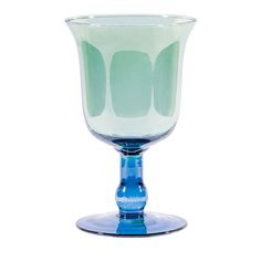 a blue glass vase sitting on top of a table