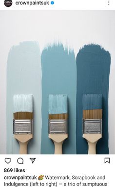 three paintbrushes with different shades of blue on them